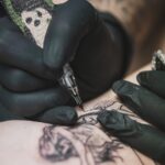 person doing tattoo