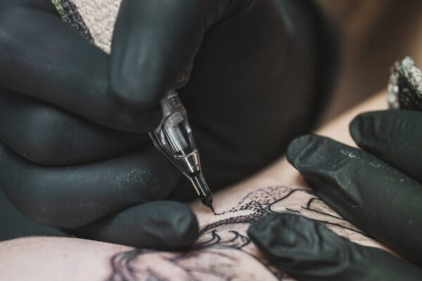 person doing tattoo