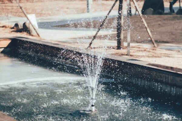 a water fountain in a park
